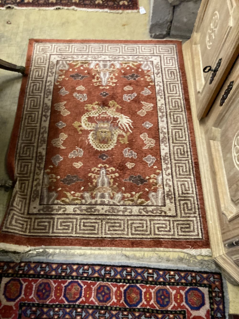 A Caucasian design rug, 150 x 94cm together with a smaller Chinese rug and a small Bokhara rug